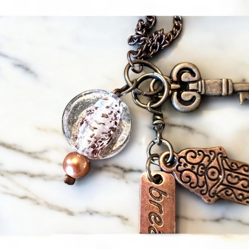 Unique bronze necklace key and charm details clear glass bead and 'breathe' tag. - Picture 6 of 15